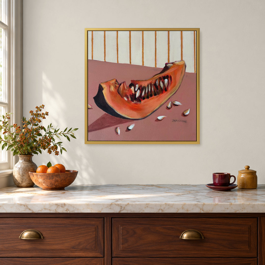 Snippets of Autumn Pumpkin by Jeannine Läderach in a warm matte gold floating frame in a kitchen